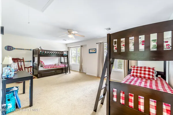 a bedroom with furniture and a window