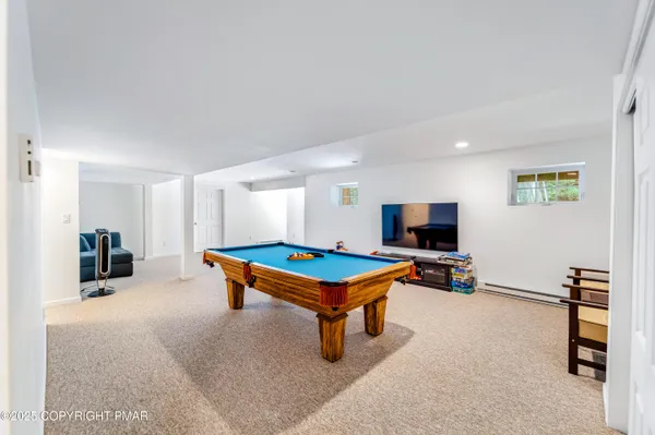 a room with furniture and a flat screen tv