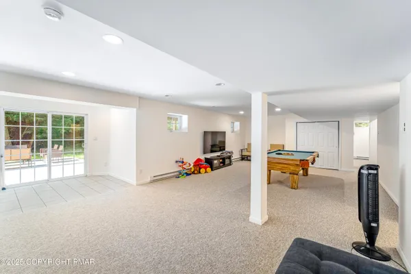 a view of a livingroom with dining room and furniture