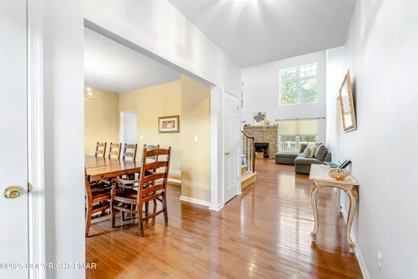 a view of a dining room with furniture window and wooden floor