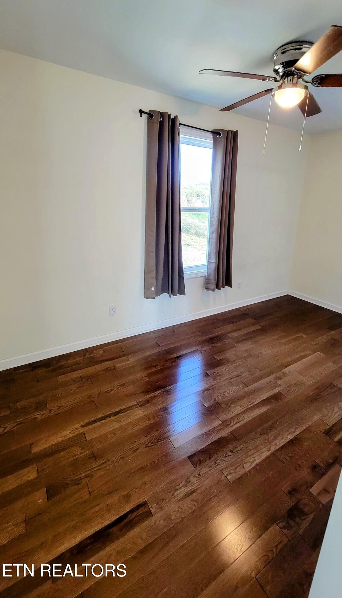 1571 Howell River Road Rutledge, TN 37861 - Photo 7 of 11 a view of an empty room with window and wooden floor