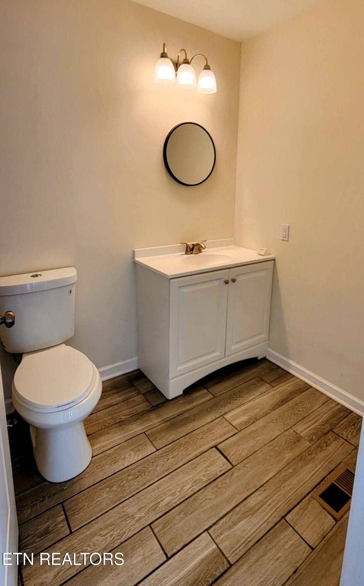 1571 Howell River Road Rutledge, TN 37861 - Photo 9 of 11 a bathroom with a sink mirror vanity and toilet