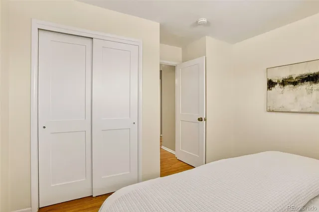 a bedroom with a bed and hallway