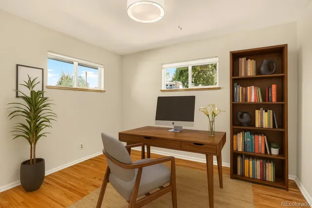 a view of a workspace with a bookshelf