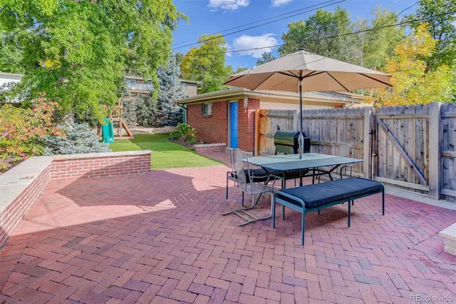 a kitchen with stainless steel appliances a stove a sink dishwasher and cabinets with wooden floor