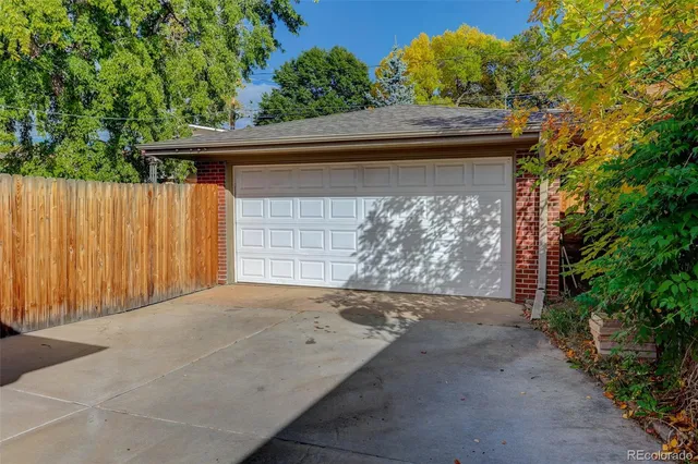 a side view of a house with a garage