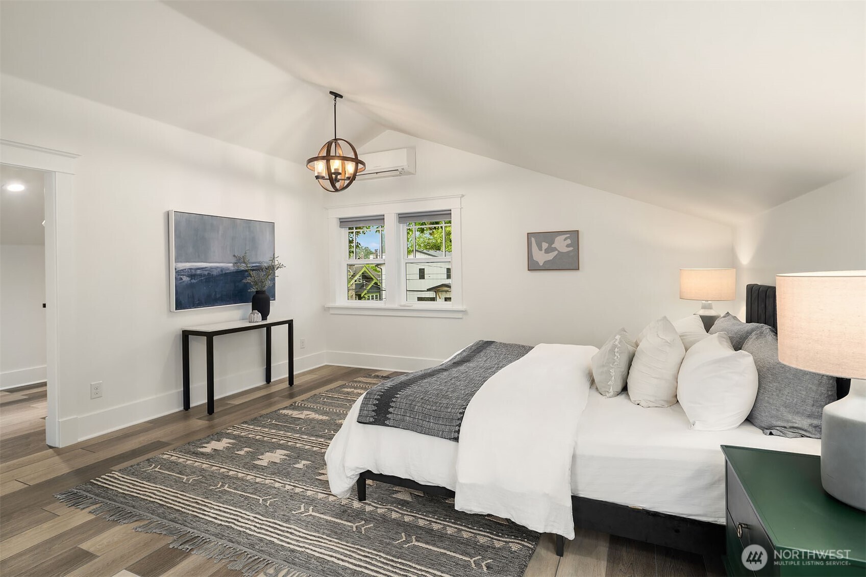 519 27th Avenue Seattle, WA 98122 - Photo 17 of 38 a bedroom with a bed and a window