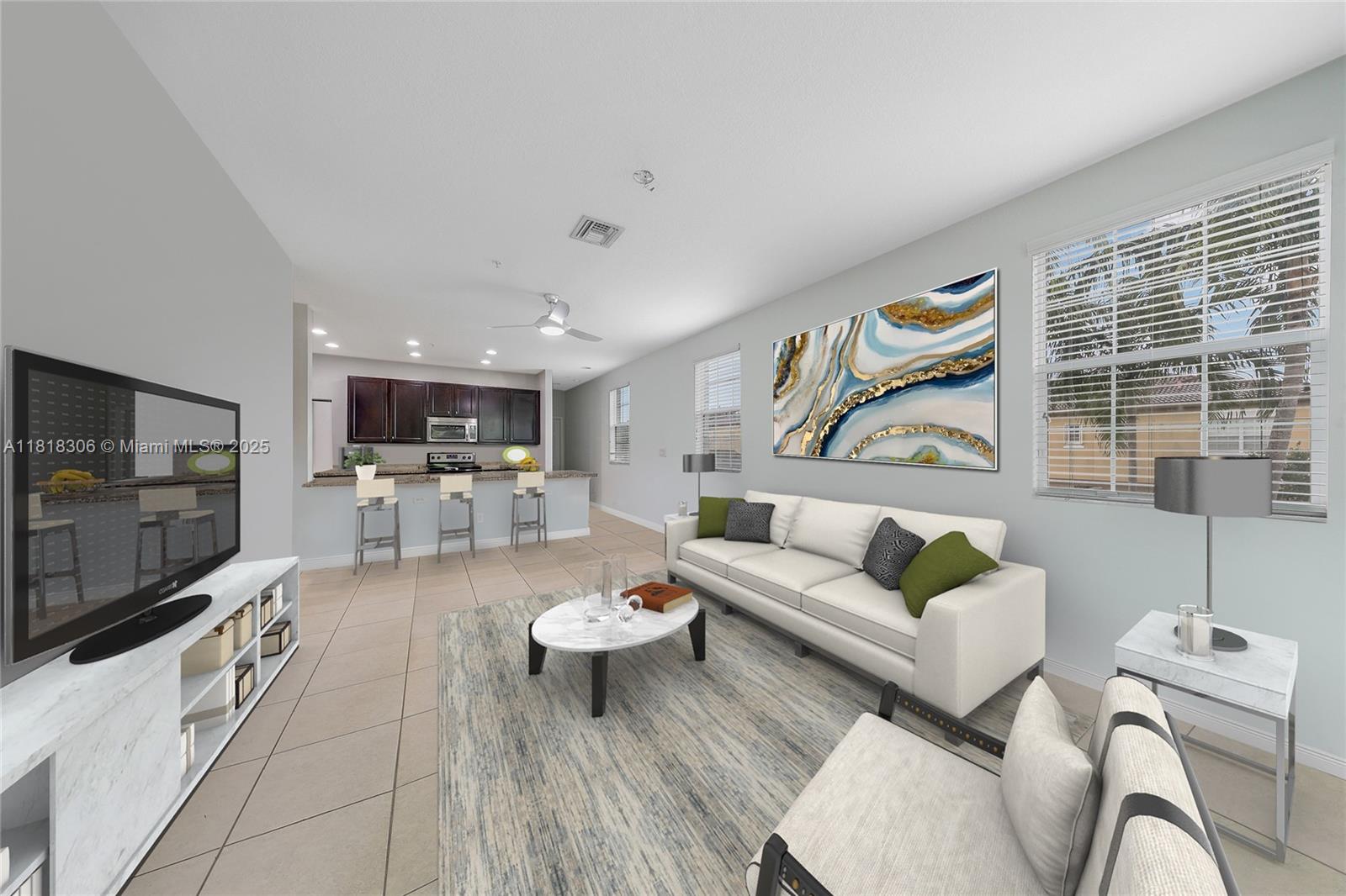 a living room with furniture and a flat screen tv