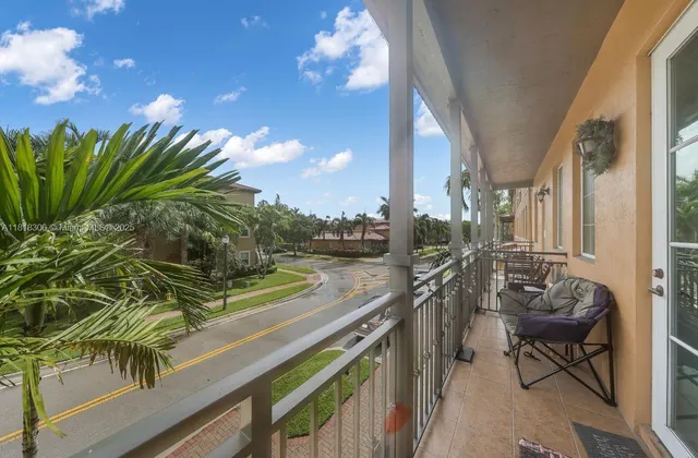 a view of a balcony with chairs