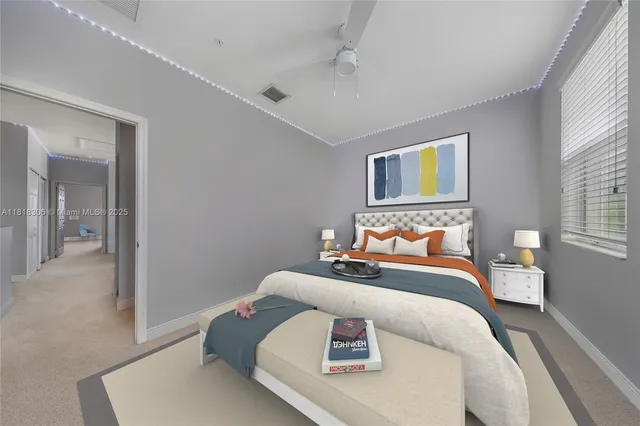 a bedroom with bed and a window