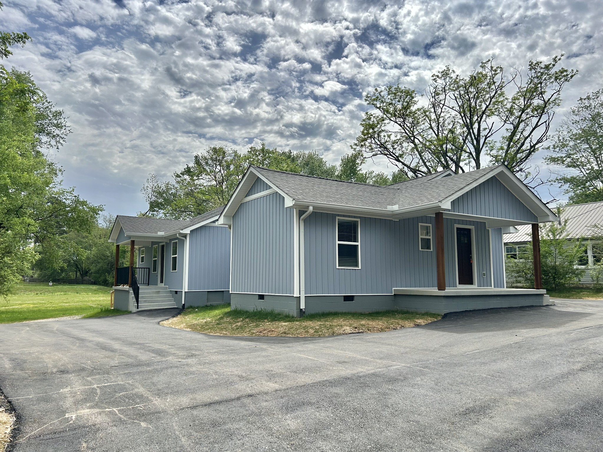 a house with trees in the background