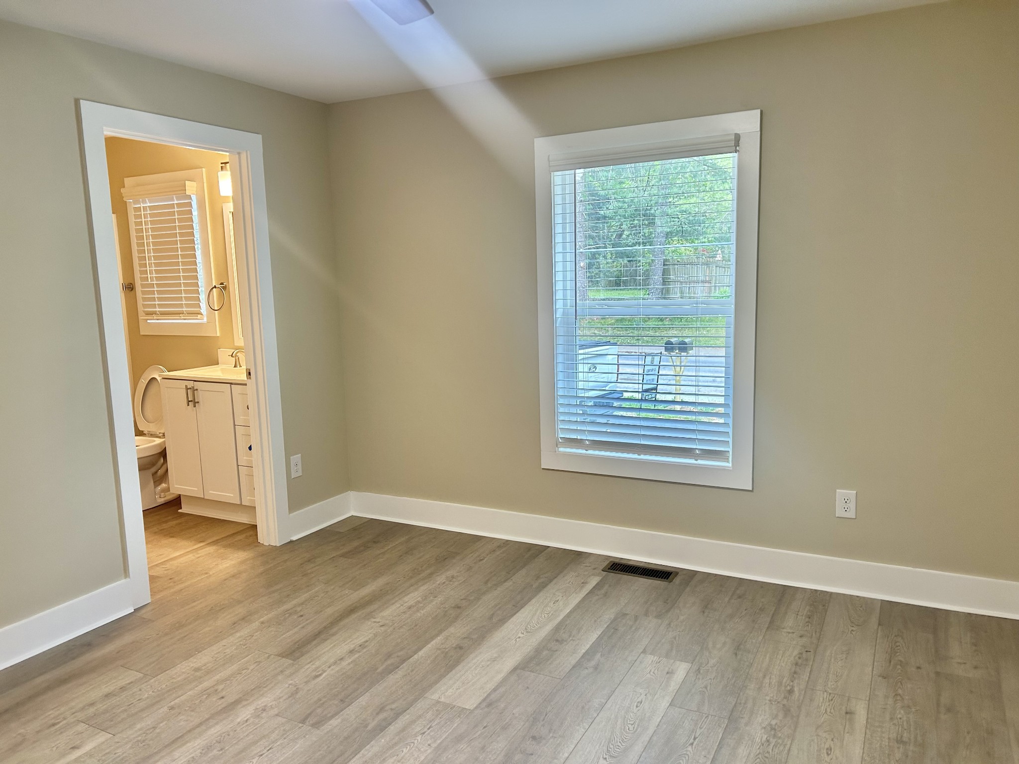 113 West Coffee Street Manchester, TN 37355 - Photo 14 of 31 an empty room with wooden floor and a window