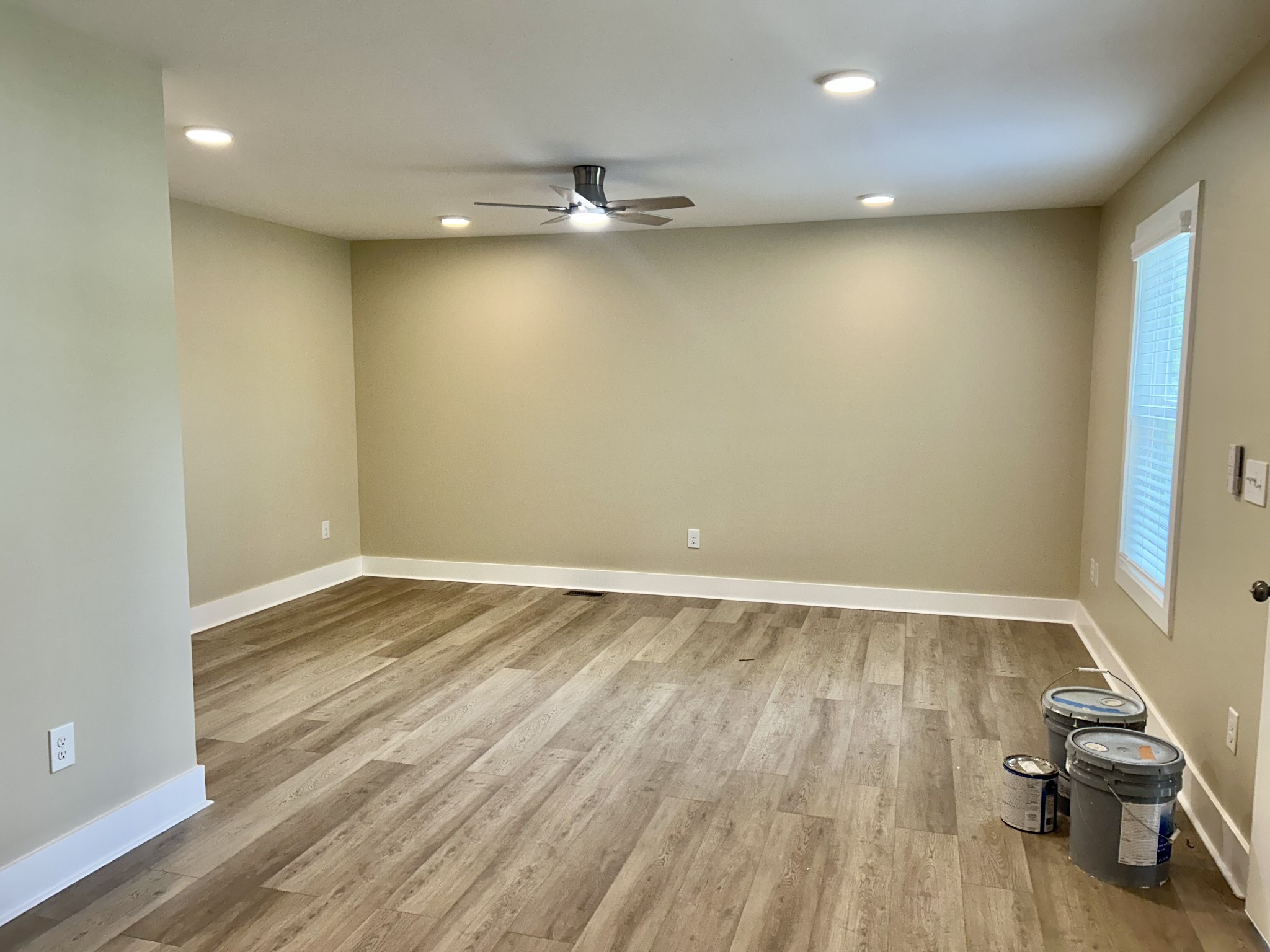 113 West Coffee Street Manchester, TN 37355 - Photo 20 of 31 an empty room with wooden floor and windows
