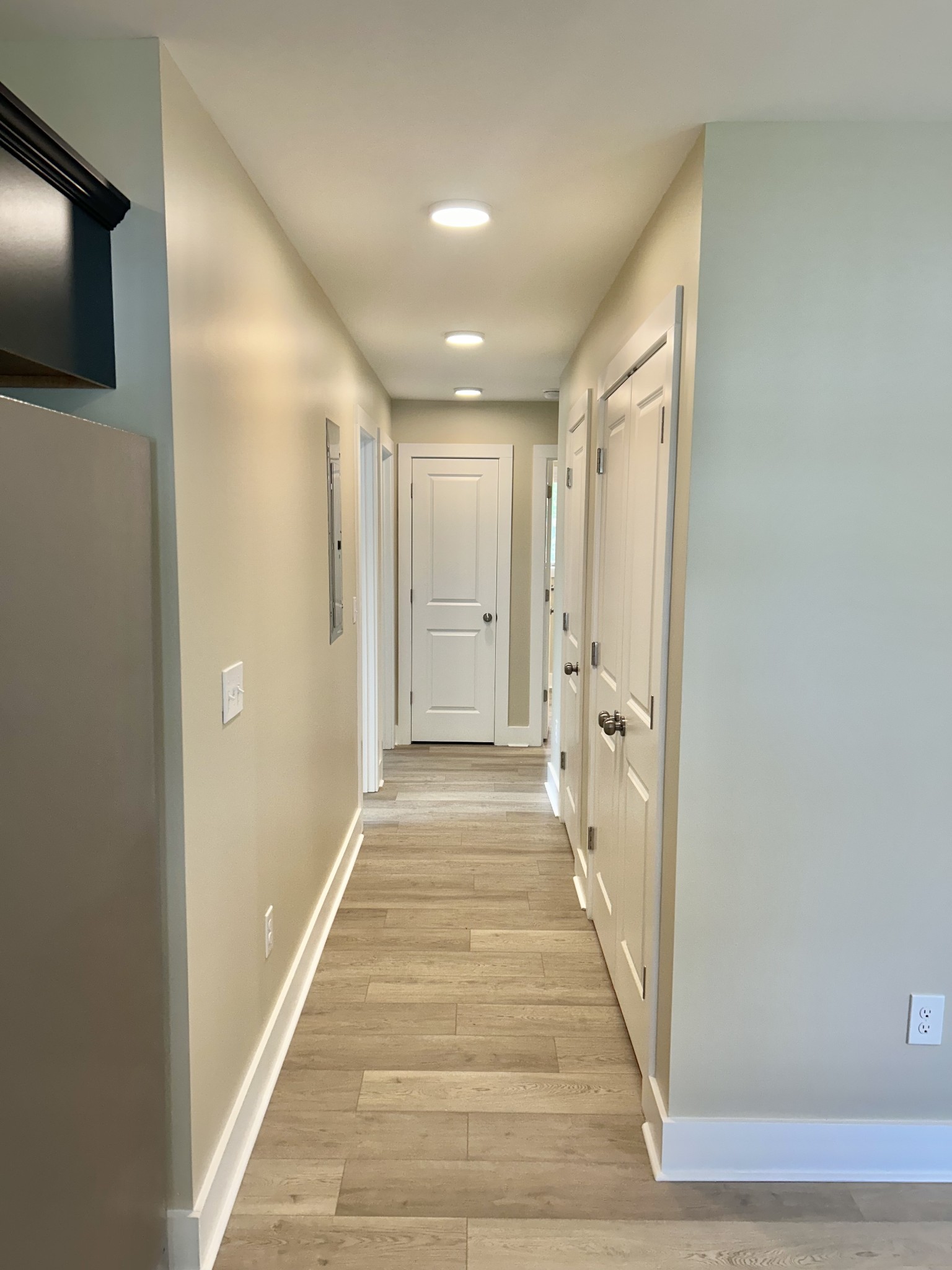 113 West Coffee Street Manchester, TN 37355 - Photo 21 of 31 a view of a hallway with wooden floor and a flat screen tv