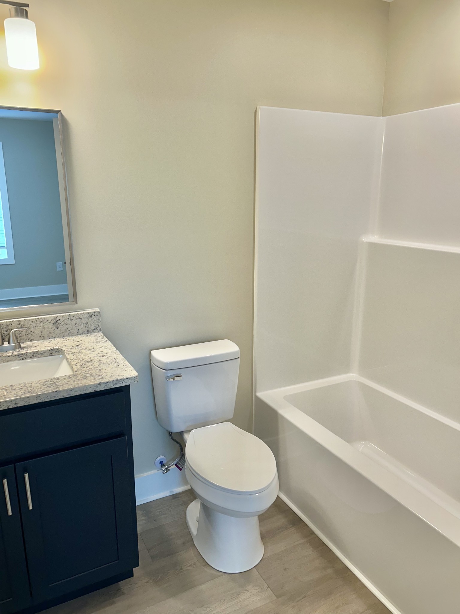 113 West Coffee Street Manchester, TN 37355 - Photo 25 of 31 a bathroom with a toilet a sink and bathtub