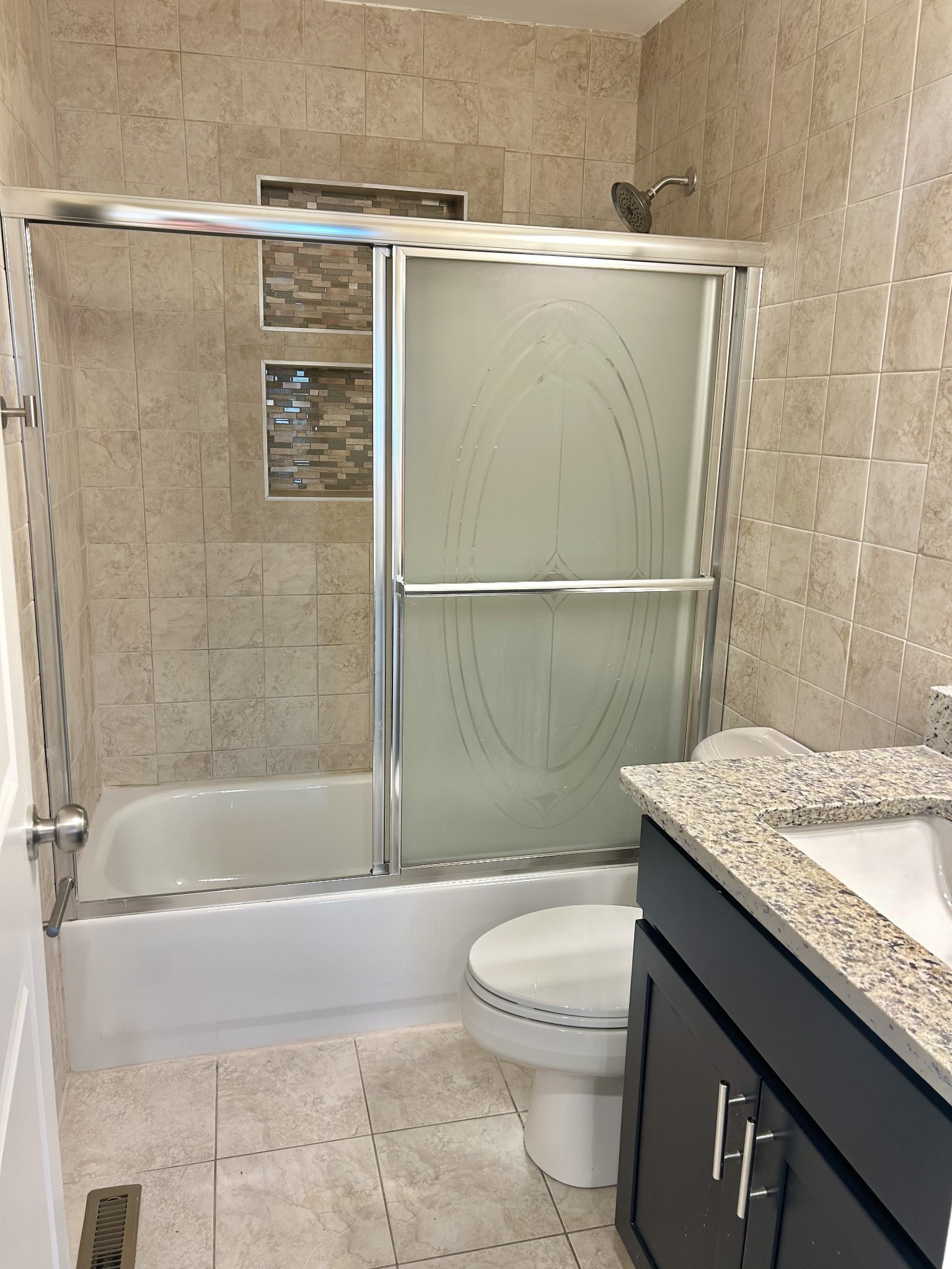 113 West Coffee Street Manchester, TN 37355 - Photo 10 of 31 a bathroom with a granite countertop sink a toilet and shower