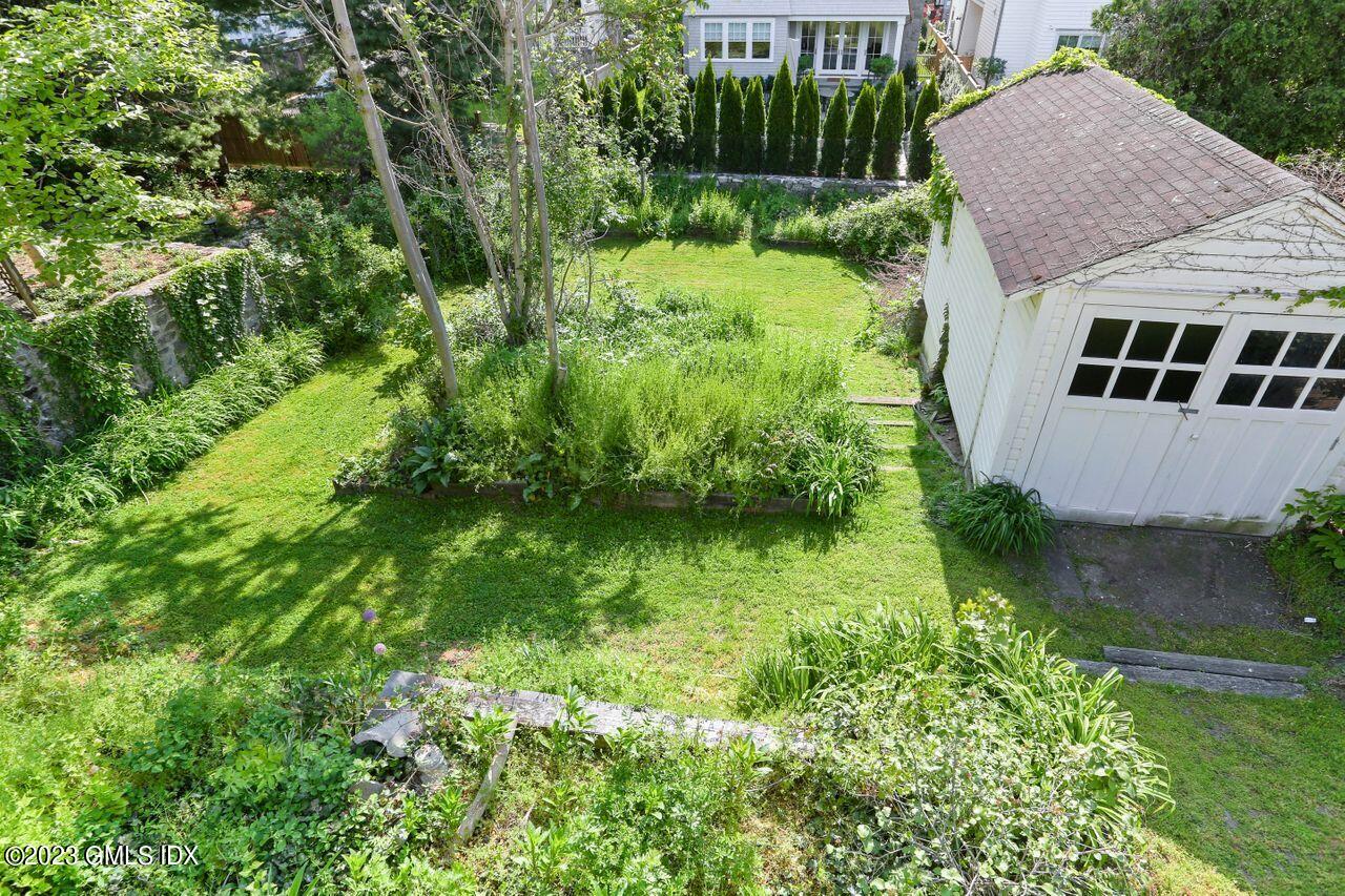 21 Ridge Street Greenwich, CT 06830 - Photo 5 of 15 a view of a backyard with potted plants