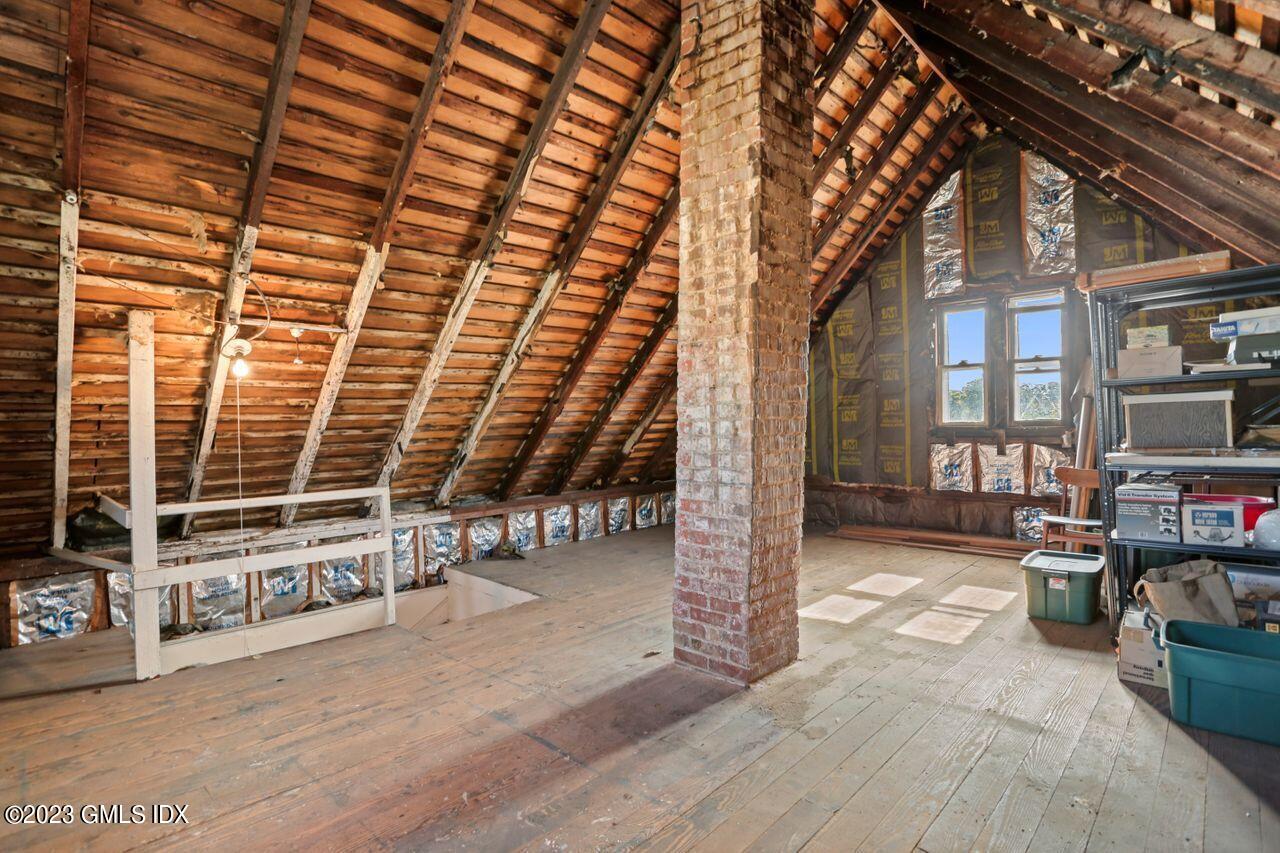 21 Ridge Street Greenwich, CT 06830 - Photo 10 of 15 a view of a patio with table and chairs and potted plants