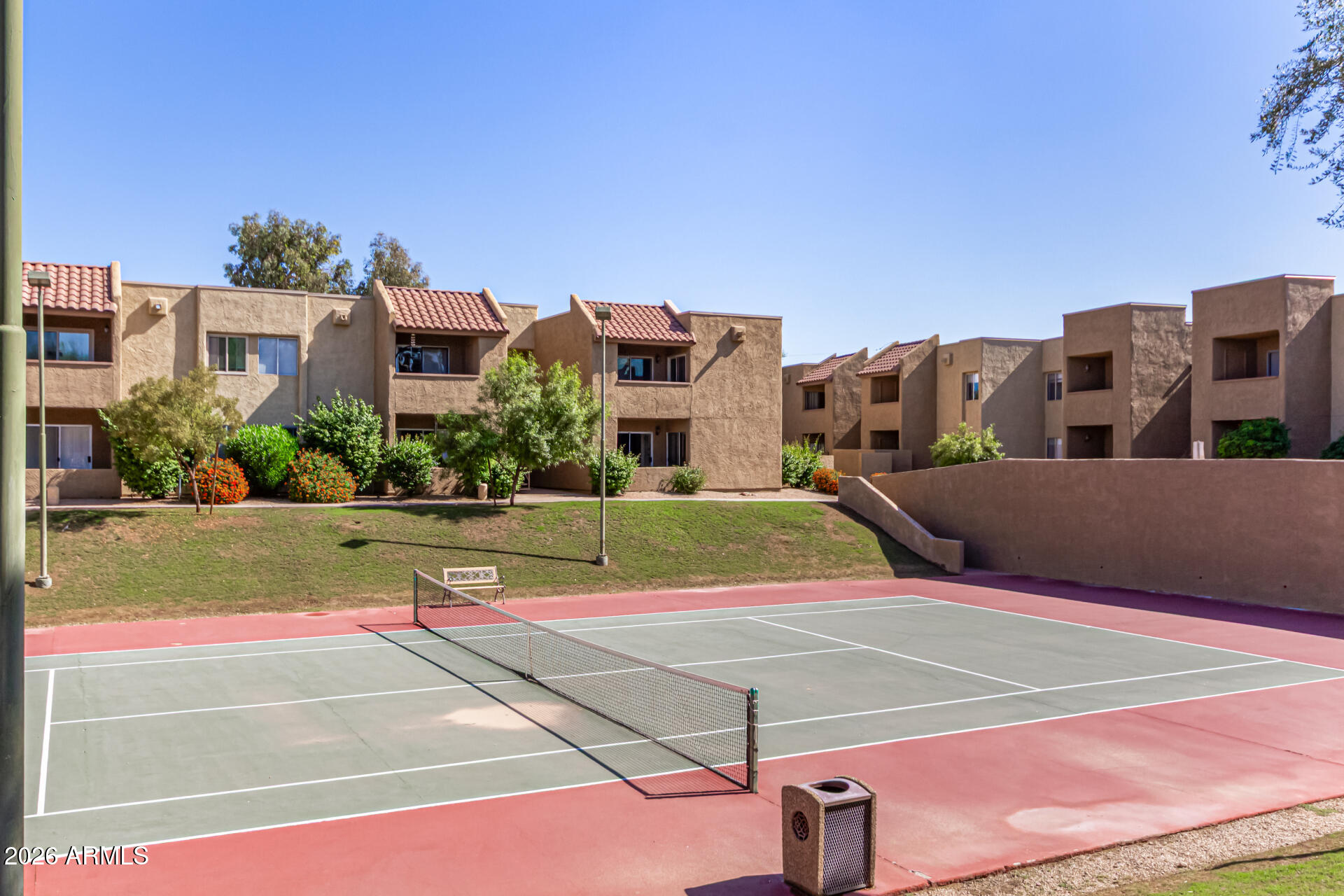 5877 North Granite Reef Road, Unit 1133 Scottsdale, AZ 85250 - Photo 28 of 33 a view of a tennis ground with large trees