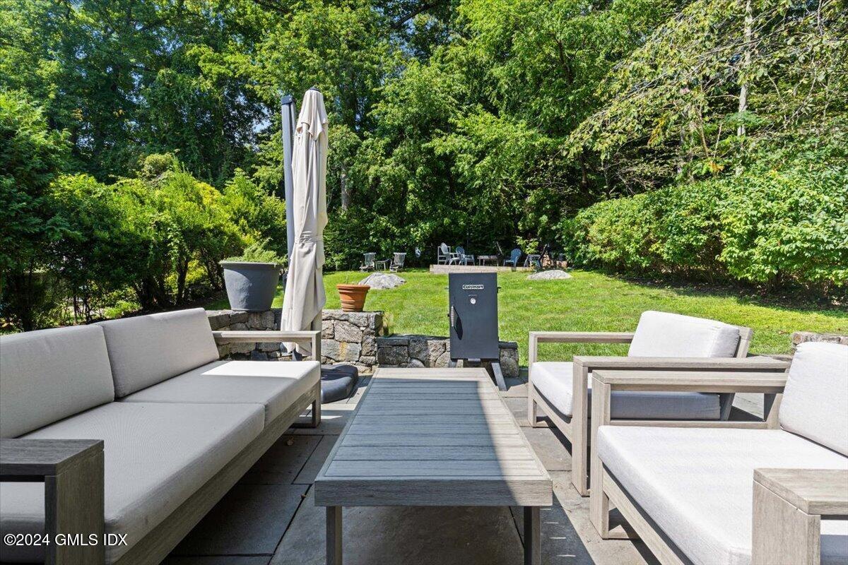 70 Gregory Road Cos Cob, CT 06807 - Photo 30 of 39 a view of backyard with seating area and green space