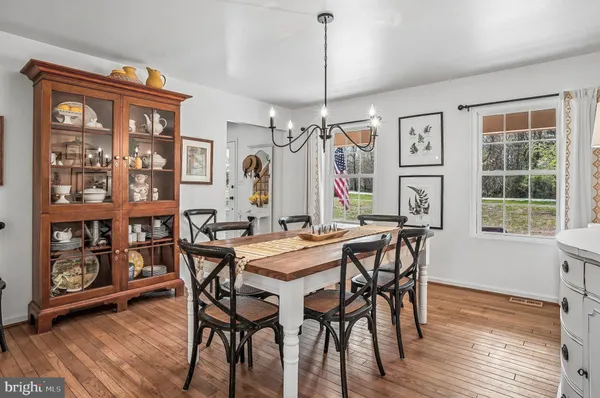 a bedroom with a bed and painting on the wall