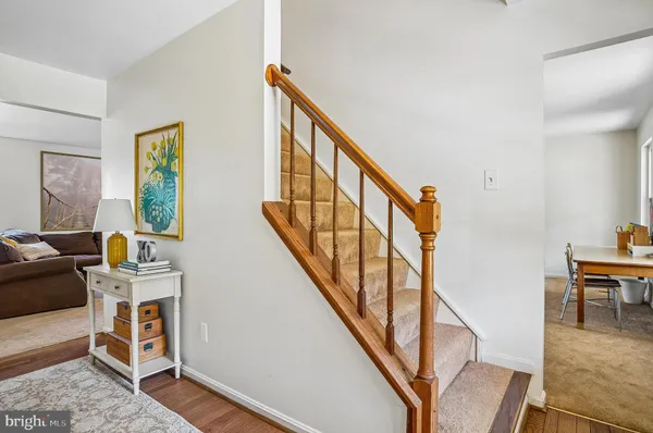 a living room with furniture and a lamp
