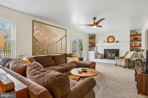 a view of a dining room with furniture and a window