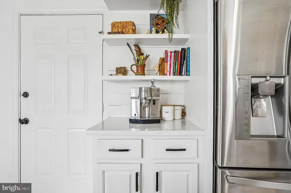 a picture of a bench in front of a wall