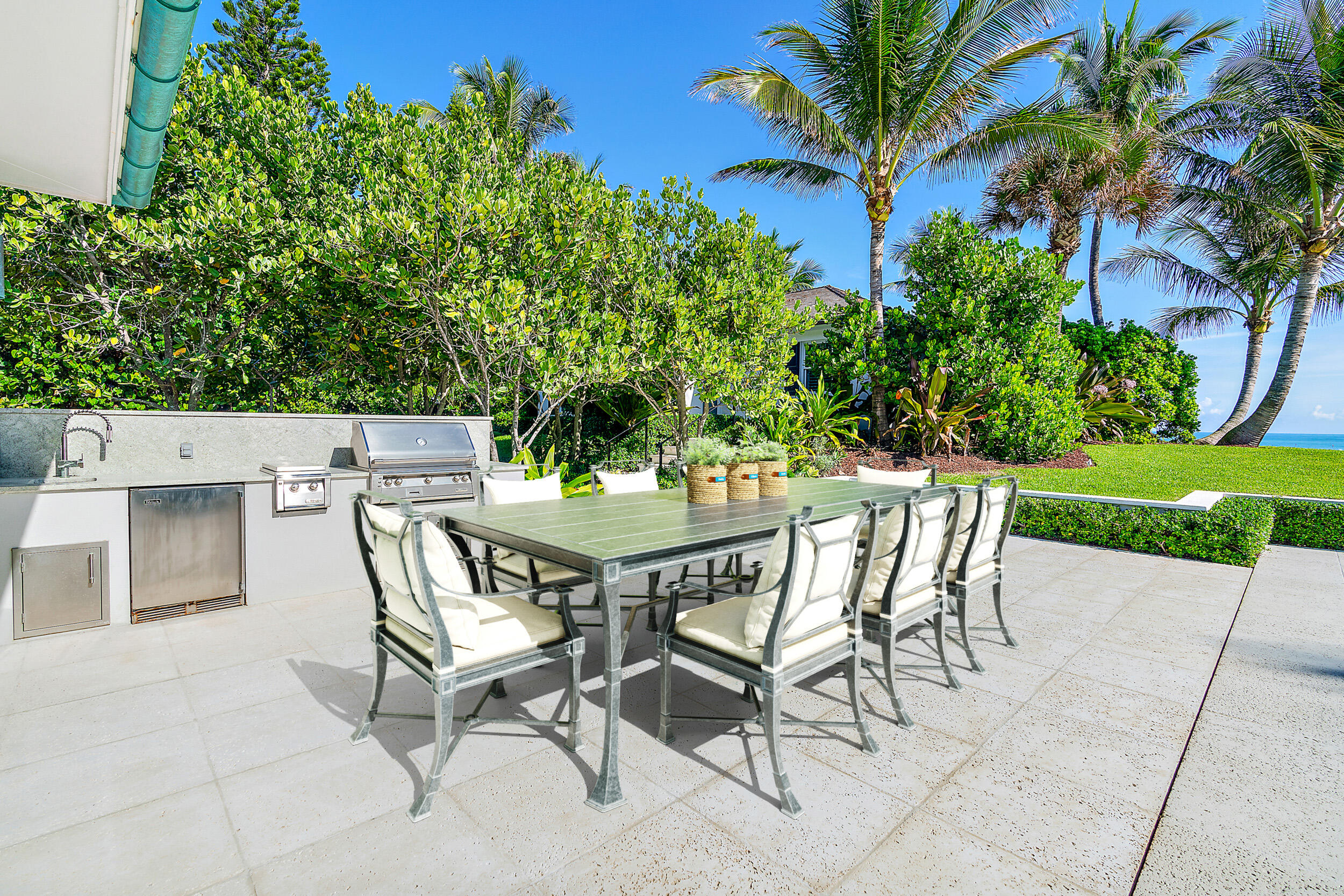 25 South Beach Road Hobe Sound, FL 33455 - Photo 21 of 28 a view of an outdoor space with a table and chairs