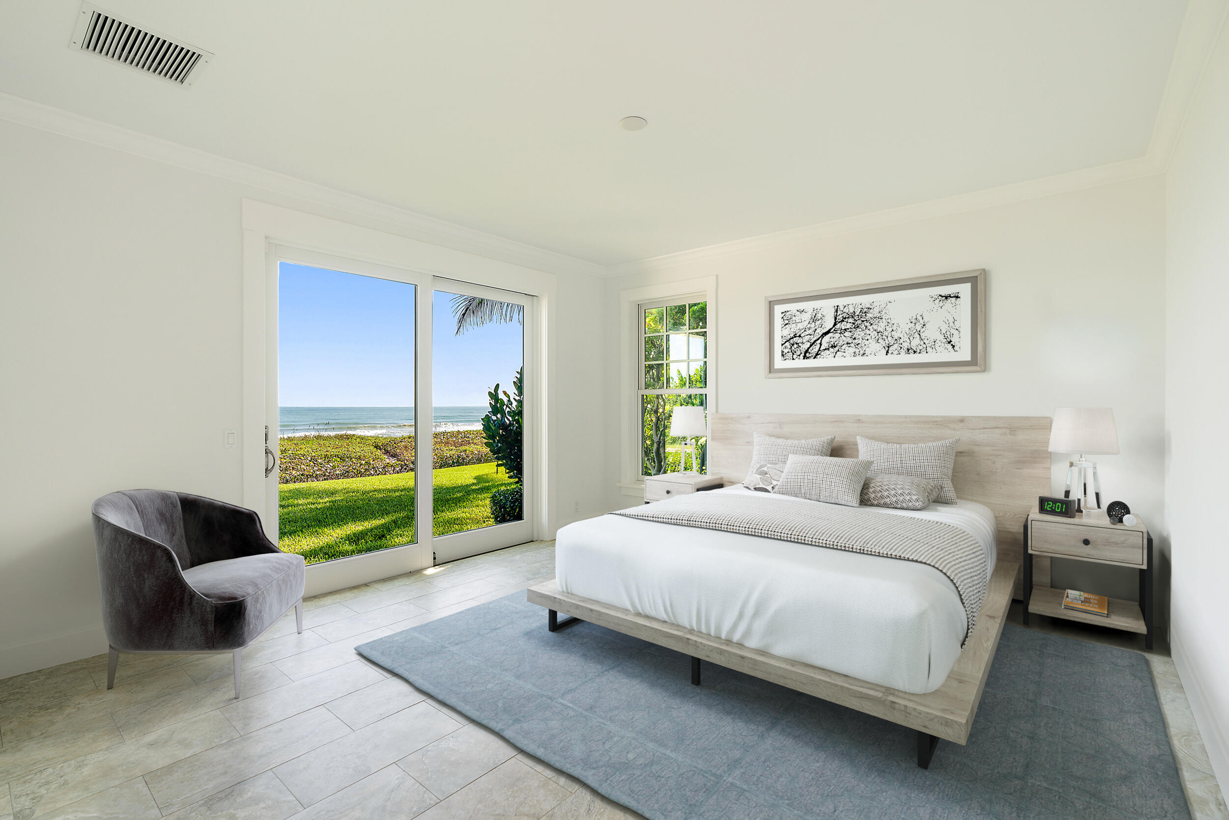 25 South Beach Road Hobe Sound, FL 33455 - Photo 26 of 28 a bedroom with a bed and a couch