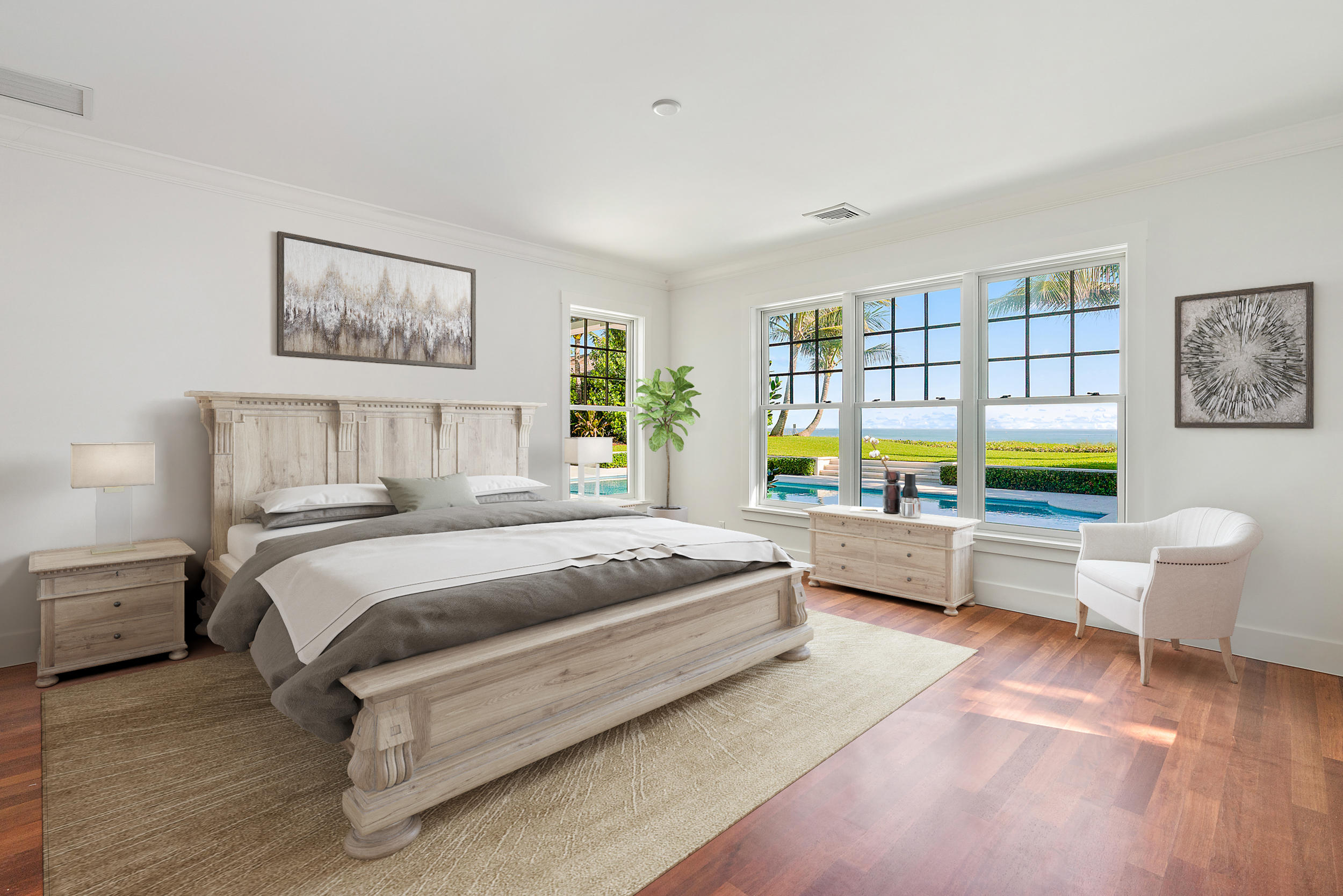 25 South Beach Road Hobe Sound, FL 33455 - Photo 10 of 28 a spacious bedroom with a bed and a couch