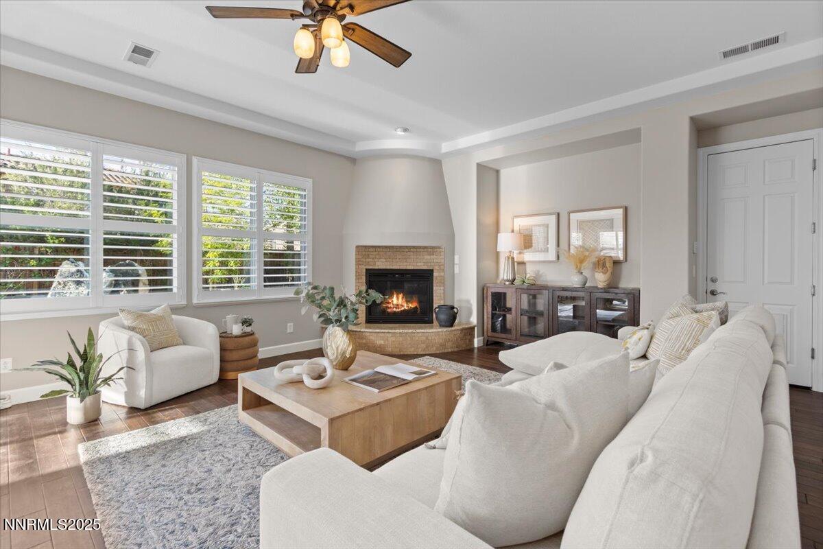 2675 Weymoor Court Reno, NV 89521 - Photo 3 of 75 a living room with furniture fireplace and a large window