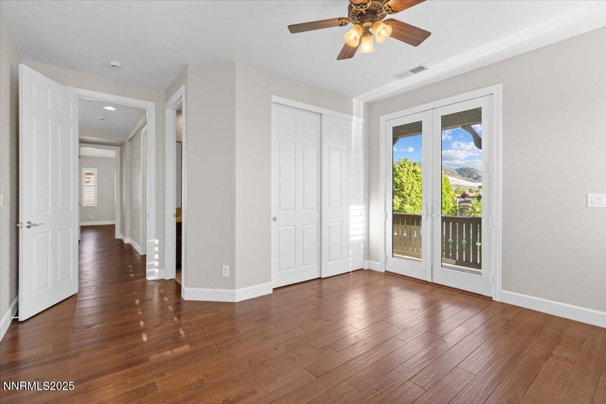 2675 Weymoor Court Reno, NV 89521 - Photo 44 of 75 a view of an empty room with wooden floor and a window