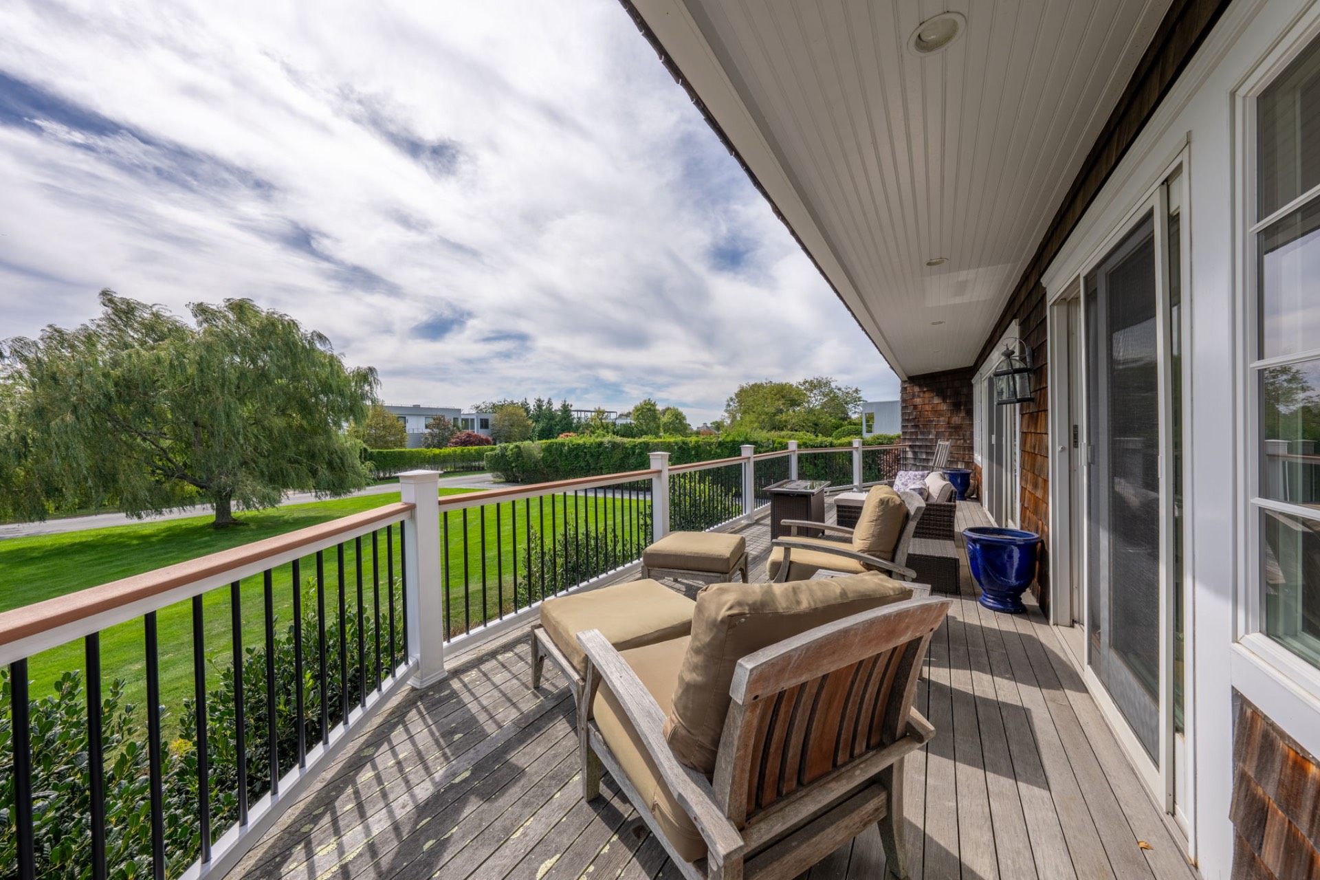 80 Sandpiper Lane Bridgehampton, NY 11932 - Photo 13 of 35 a view of a patio with a table chairs and a couches