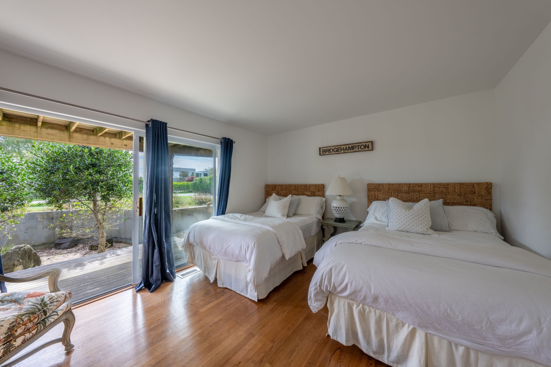 80 Sandpiper Lane Bridgehampton, NY 11932 - Photo 18 of 35 a bedroom with two beds and a large window