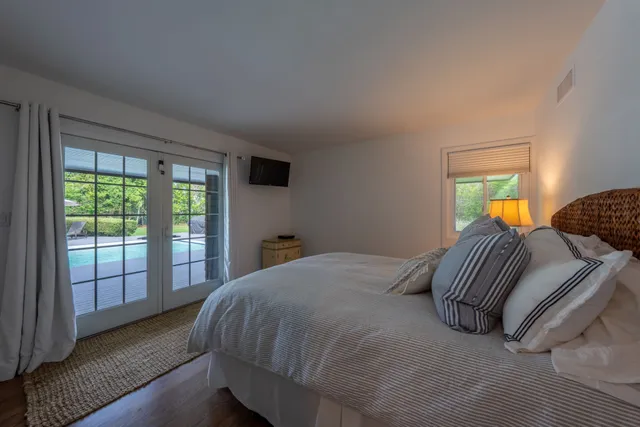 a bedroom with a bed and a couch