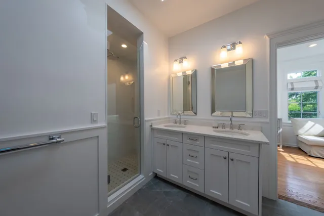 a bathroom with a double vanity sink and mirror