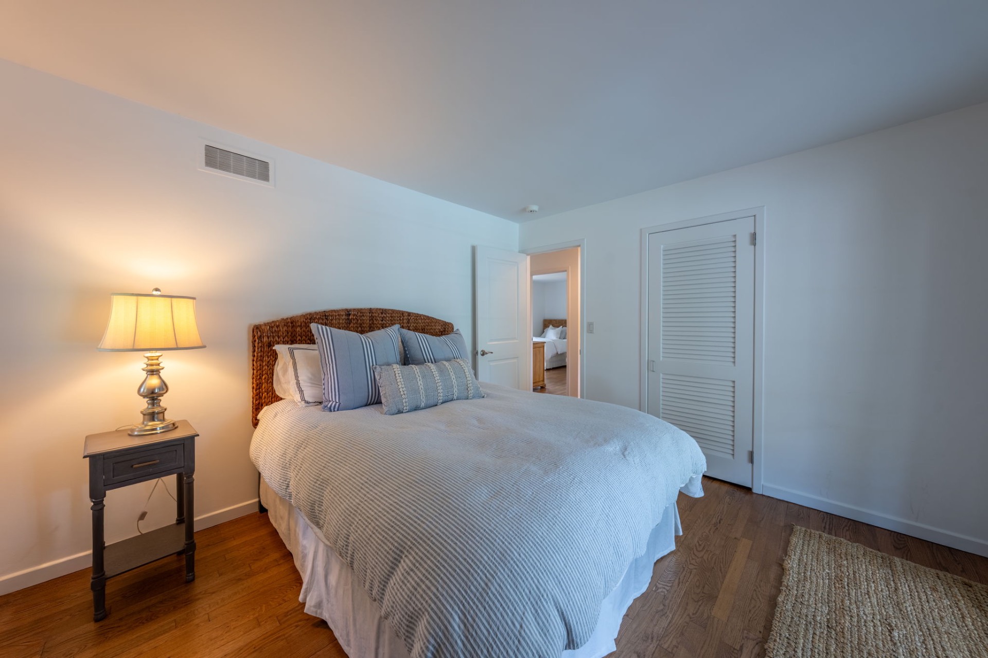 80 Sandpiper Lane Bridgehampton, NY 11932 - Photo 24 of 35 a bedroom with a bed and wooden floor