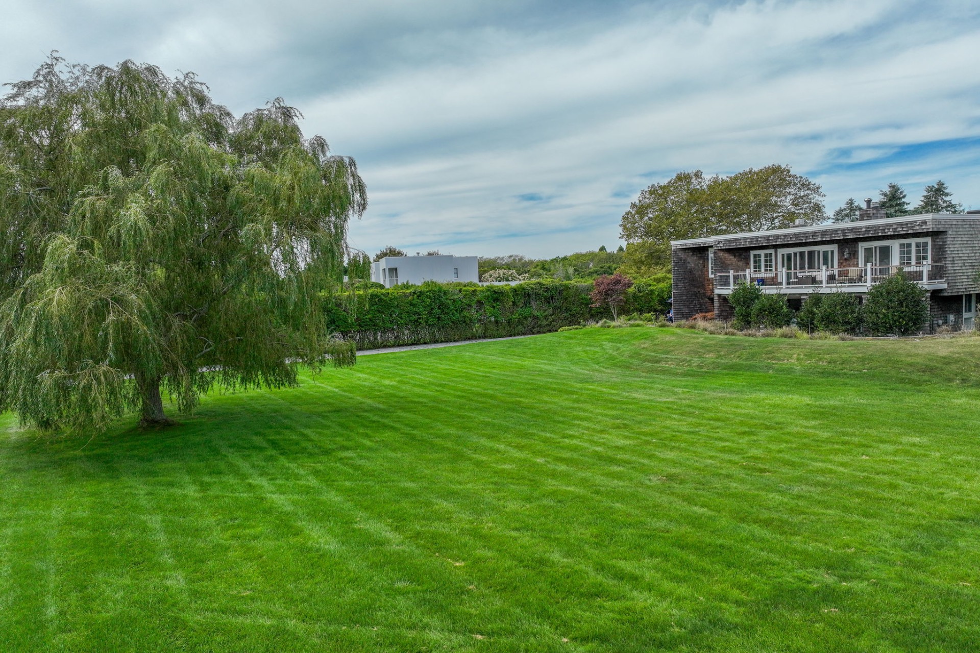 80 Sandpiper Lane Bridgehampton, NY 11932 - Photo 25 of 35 a view of a big yard with plants and large trees