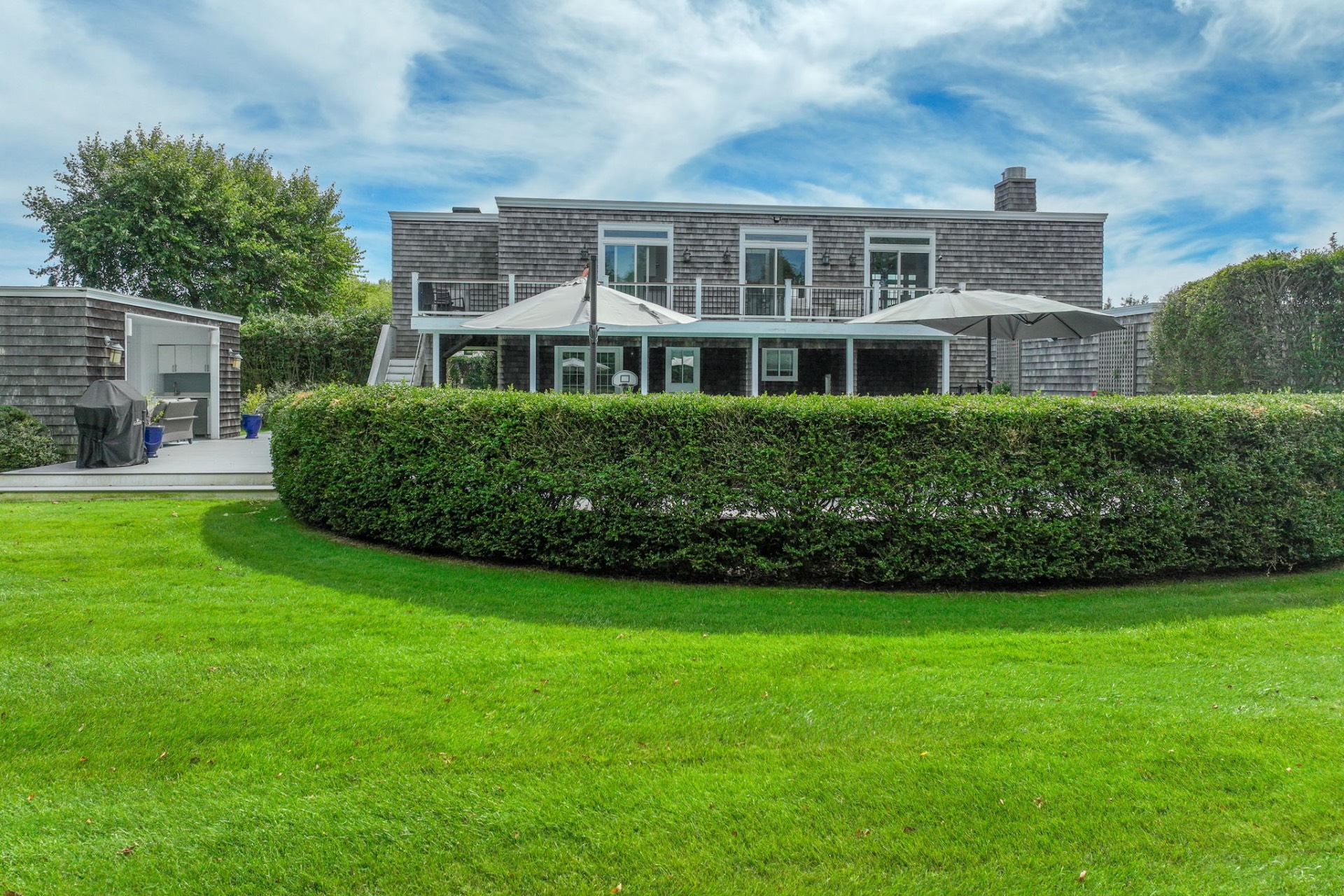 80 Sandpiper Lane Bridgehampton, NY 11932 - Photo 3 of 35 a front view of a house with a yard
