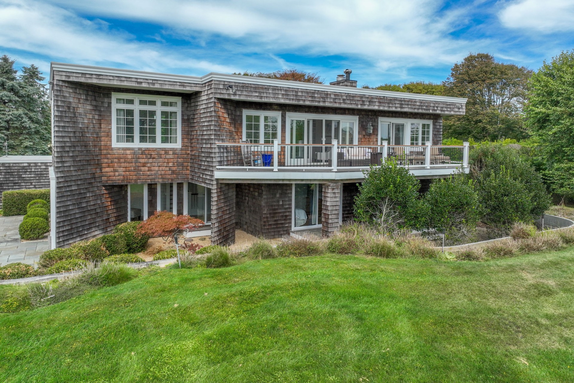 80 Sandpiper Lane Bridgehampton, NY 11932 - Photo 33 of 35 a view of house with a yard and potted plants