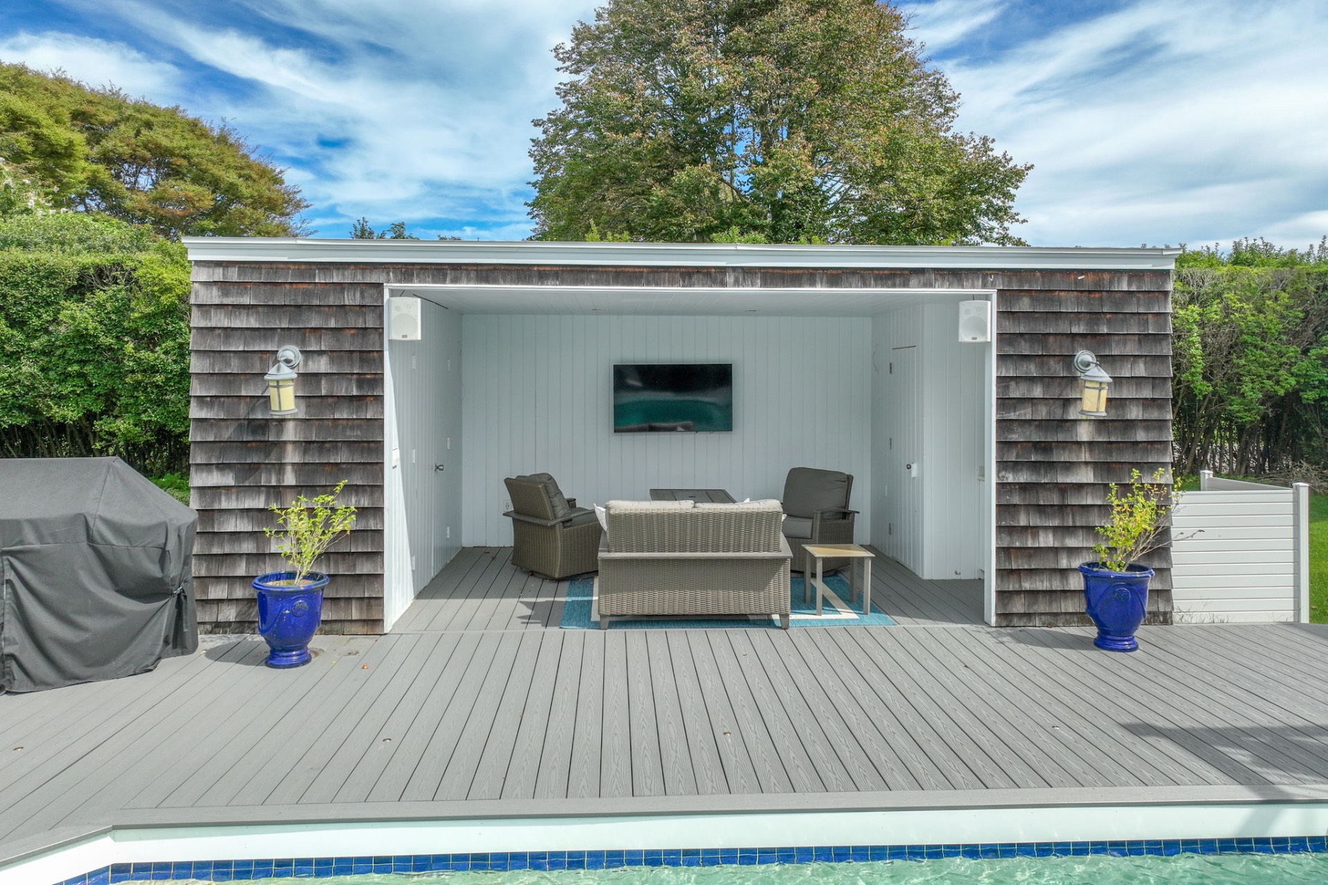 80 Sandpiper Lane Bridgehampton, NY 11932 - Photo 4 of 35 a view of a deck with table and chairs and wooden floor