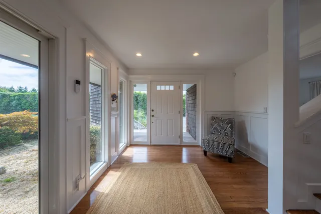 a view of gallery with wooden floor