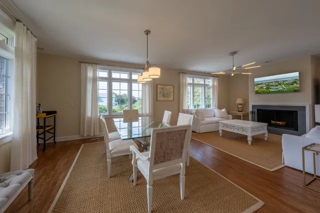 a view of a livingroom with furniture window and wooden floor