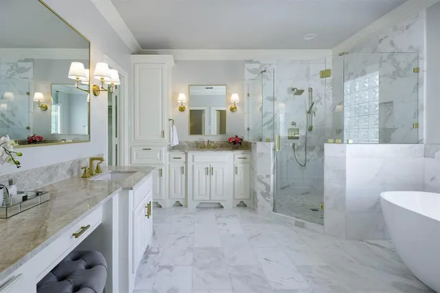 a spacious bathroom with a shower sink and a mirror