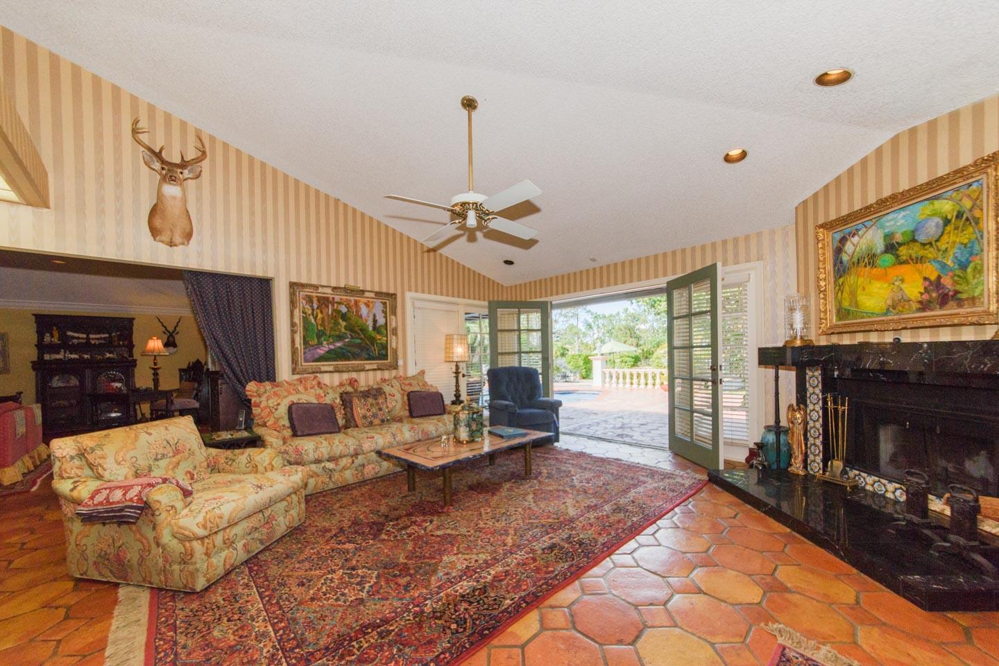 9085 Perth Road Lake Worth, FL 33467 - Photo 36 of 100 Family Room & French Doors open to Pool