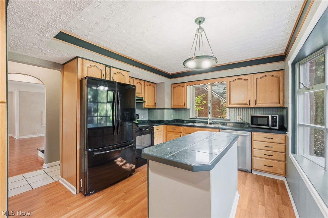 6832 Hillside Road Independence, OH 44131 - Photo 14 of 44 Kitchen with an island and large window with plenty of natural light