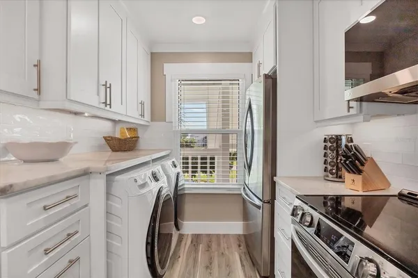 a kitchen with a stove cabinets and a sink