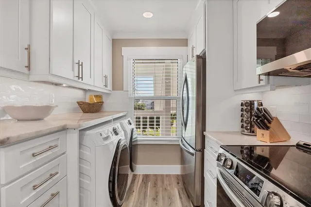 a kitchen with a stove cabinets and a sink