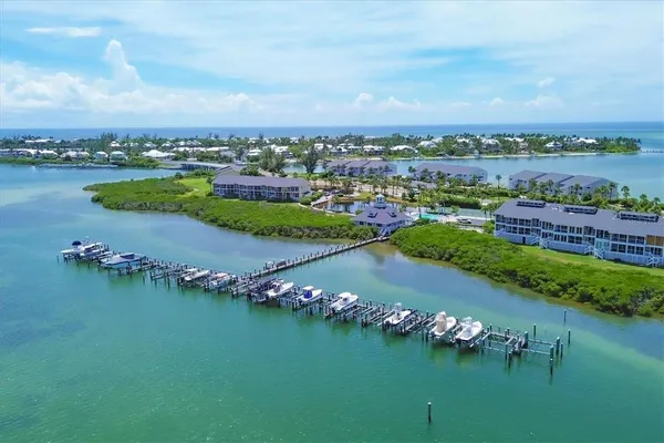 an aerial view of a city with a lake view